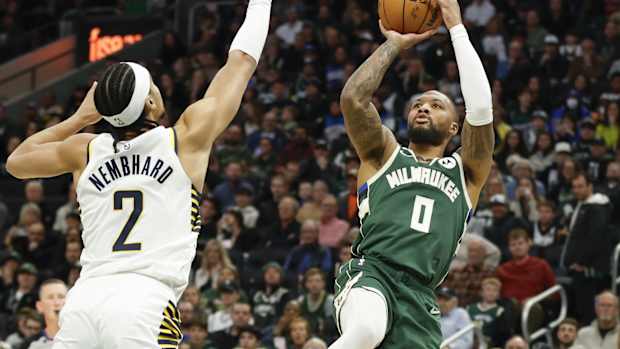 Milwaukee Bucks guard Damian Lillard (0) shoots against Indiana Pacers guard Andrew Nembhard (2)